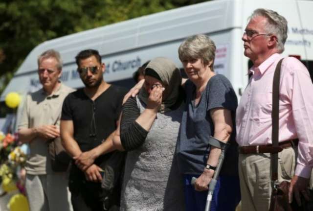 Britons cry for London fire victims as death toll rises to 79