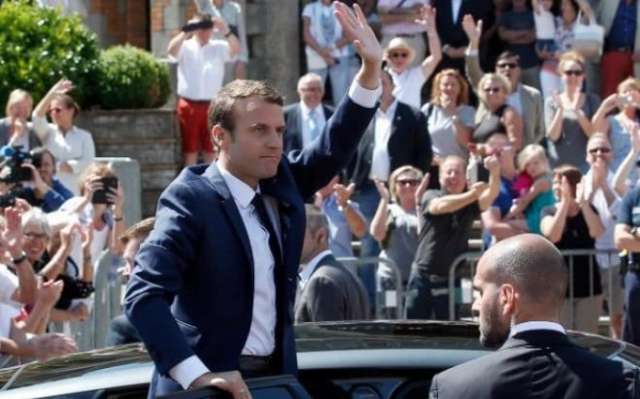 Macron's party set for parliamentary majority, polls show
