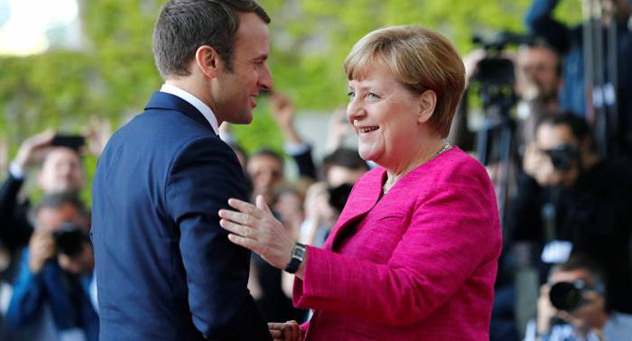 Législatives: Macron félicite Angela Merkel