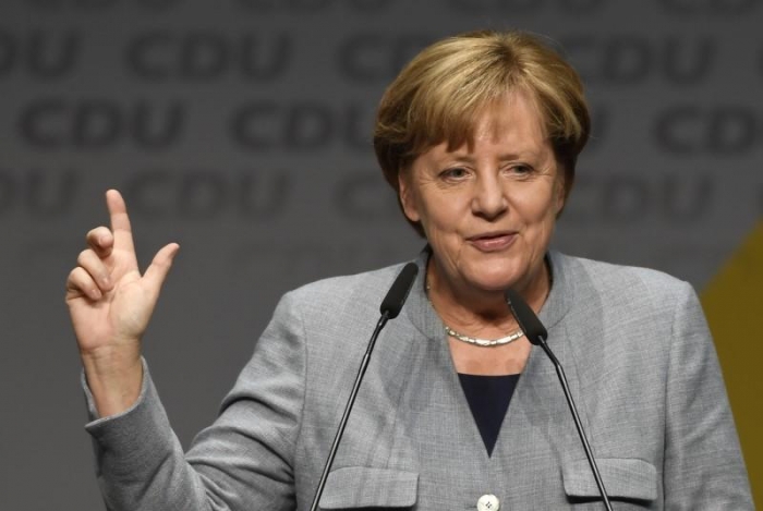 Merkel: State defeat has not weakened conservatives before coalition talks