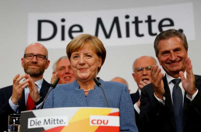 Chastened Merkel braces for coalition tussle after vote