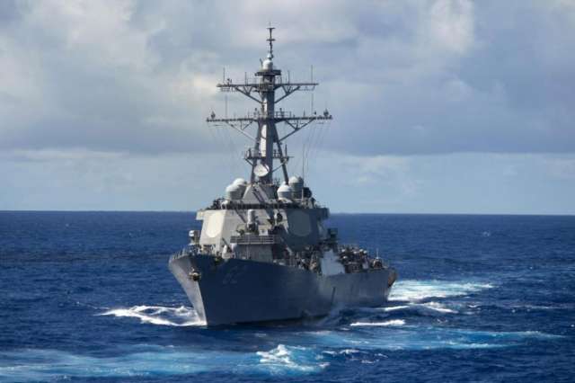 Seven sailors missing after US warship collides with merchant vessel off Japan
