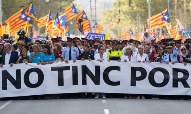 Spain attacks: thousands march through Barcelona in show of defiance
