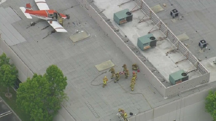 One hospitalized after small plane lands on roof in California