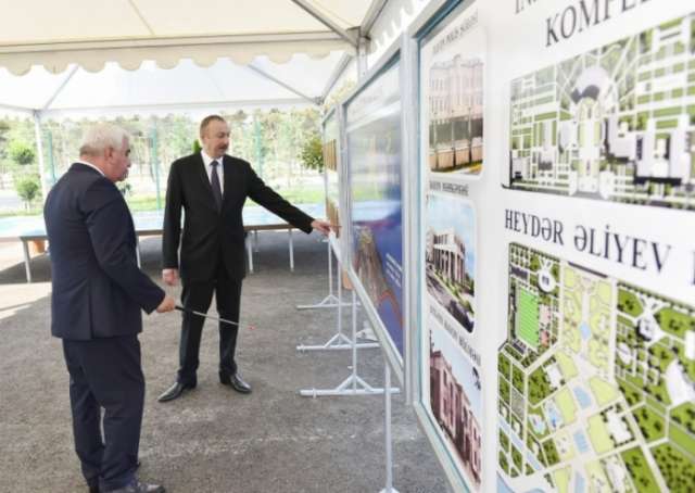President Ilham Aliyev views plans of work to be done in center of Pirallahi - PHOTOS
