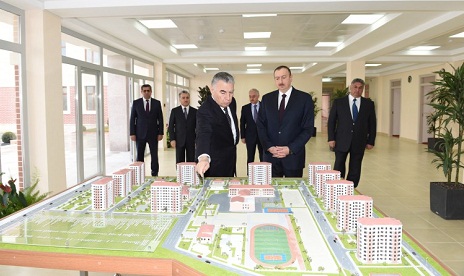 President Ilham Aliyev reviews newly-built residential complex for IDP families in Mingachevir