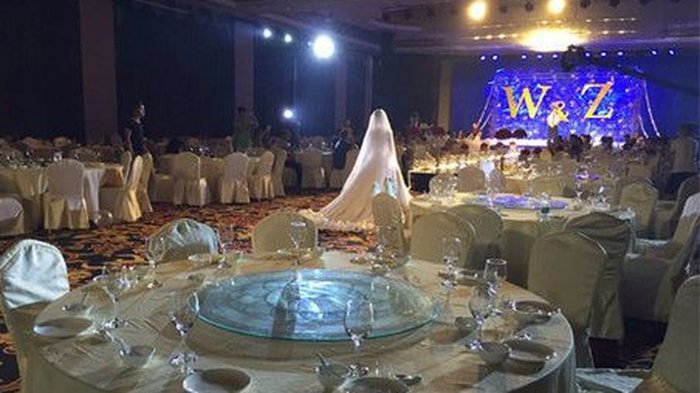 Chinese couple goes ahead with wedding despite freak storm that kept guests away