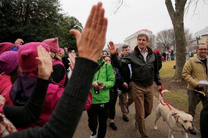 Kerry and his dog stroll through women`s march