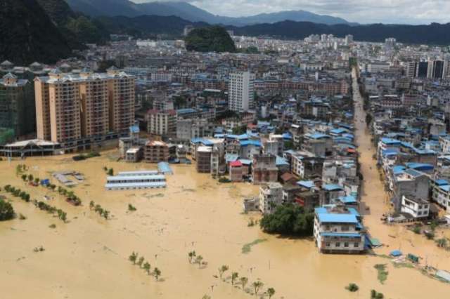 South China floods kill 15, thousands evacuated