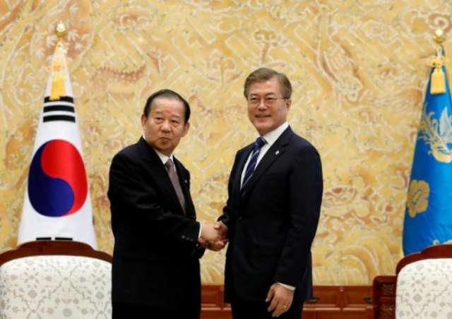 South Korea's Moon asks for Japan's patience in resolving 'past history'