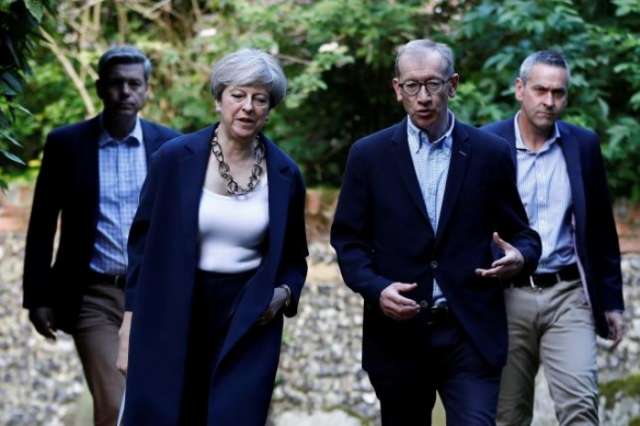 British PM May tells lawmakers she'll stay as long as they want her