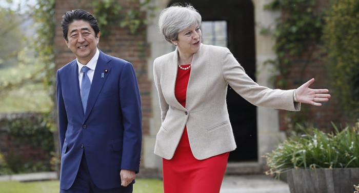 Theresa May flies to Japan to boost post-Brexit trade amid N Korea missile shock