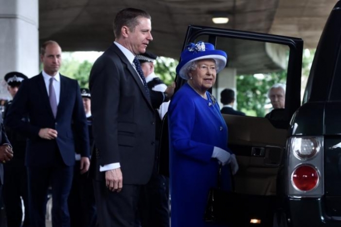 UK queen visits London fire volunteers as locals plead for answers