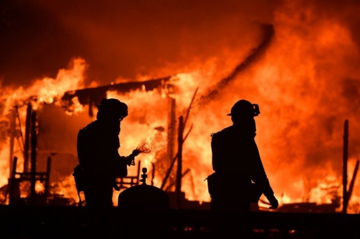 Wildfires in Northern California kill at least 10 and destroy 1,500 buildings