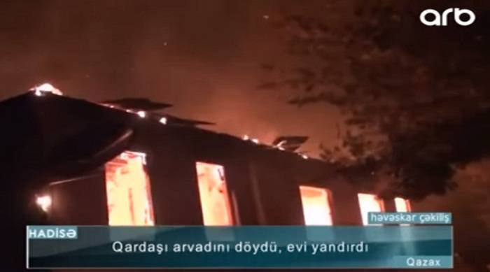 Qardaşı arvadını çəkiclə döyüb evi yandırdı - Video