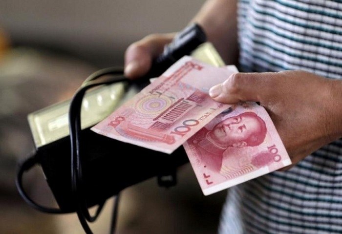 Chinese yuan weakens to 6.5693 against USD